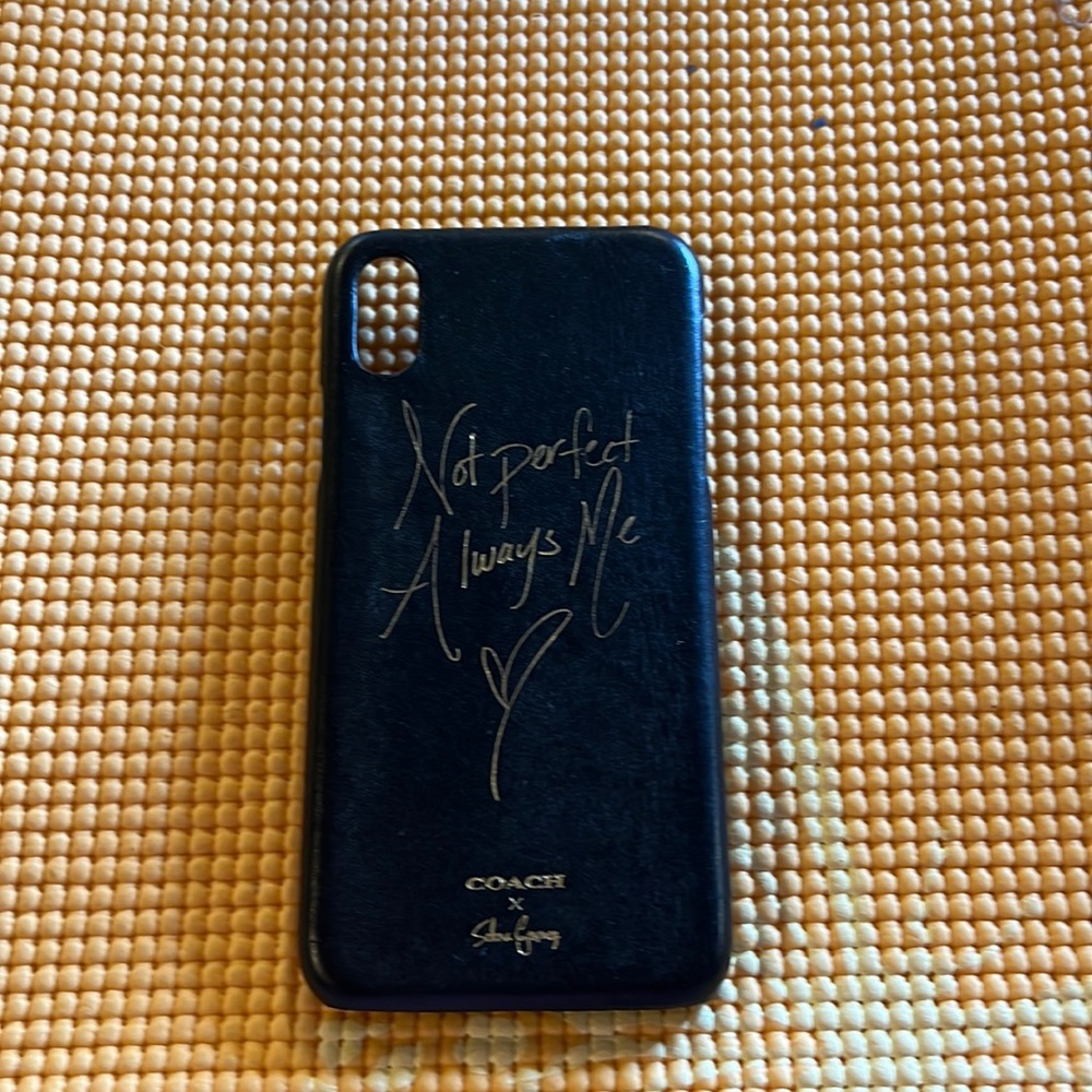 Beautiful black with gold trim writing by Coach IPhone XS case.